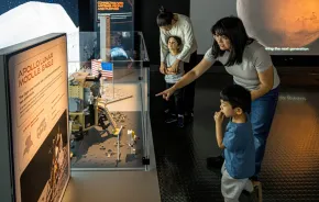 moms and kids at the Artemis Adventure with Lego Bricks exhibit