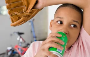 boy drinking from a can