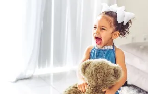 screaming little girl toddler playing at home