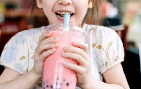 little girl drinking boba bubble tea