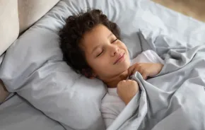 boy sleeping in bedroom