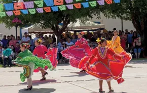girls perform traditional dance in town square at festival