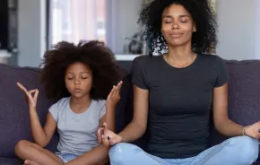 Mom and child using breathing exercises to hold off a tantrum