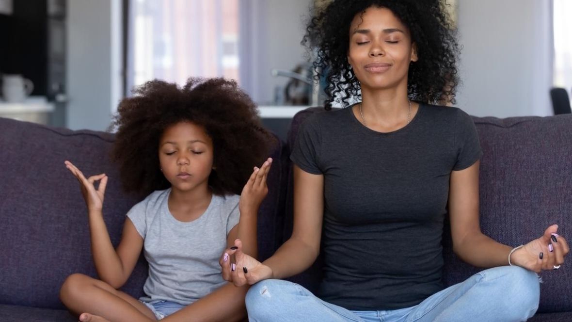 mother and daughter meditating
