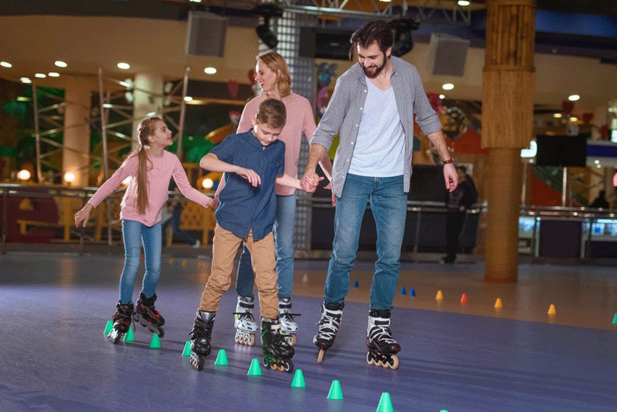 family skating at a roller rink