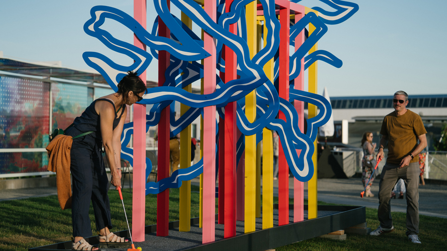 families playing a round of mini golf at Olympic Sculpture Park during SAM's pop-up summer event