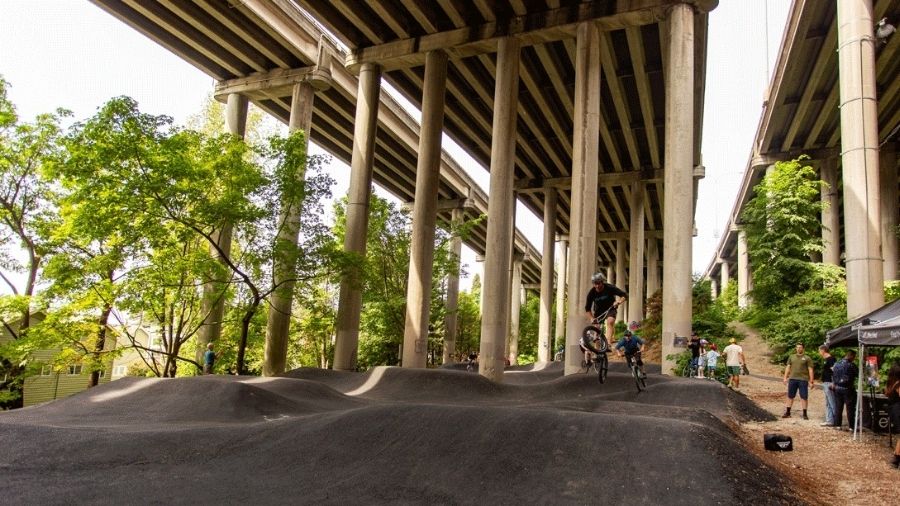 bikers on the new pump track at I-5 Colonnade Park in Seattle