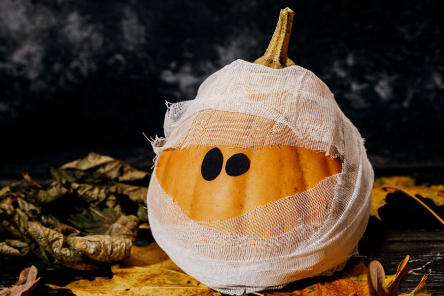 Pumpkin decorated to look like a mummy for Halloween