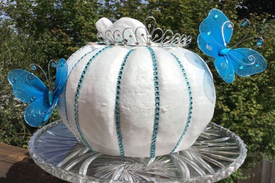 No carve pumpkin decorated like a princess with jewels and butterflies