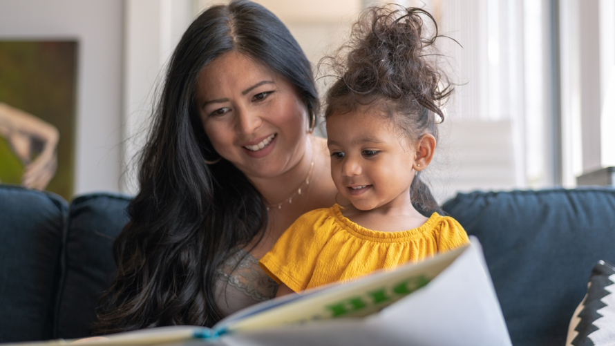 Mom and daughter reading a women's history month picture book