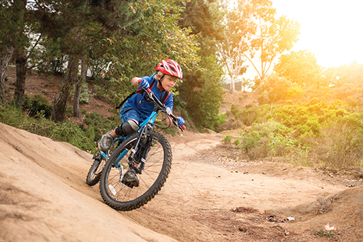 Young boy riding a mountain bike