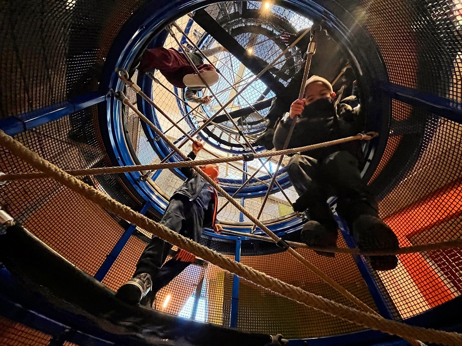 Kids on the climbing structure at KidsQuest Children's Museum