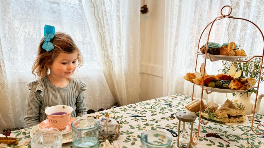 young girl sitting at Paisley's Tea Room, a family-friendly afternoon tea spot for Seattle families