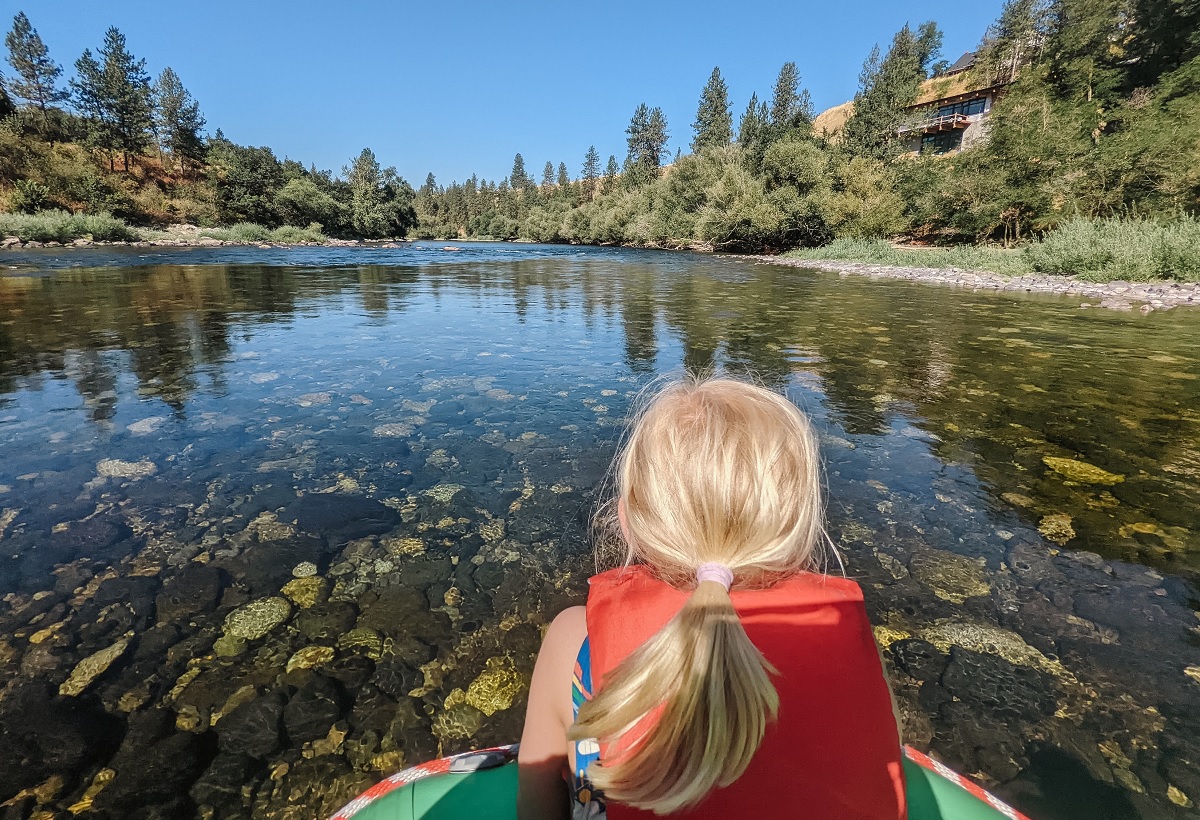 Little girl sitting on a raft on a scenic float with Wiley E. Waters in Spokane, WA
