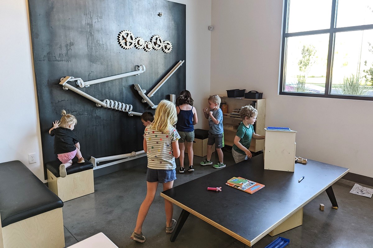 Children play in the kids’ play area at Uprise Brewing, a family-friendly brewery in Spokane, destination for Seattle families