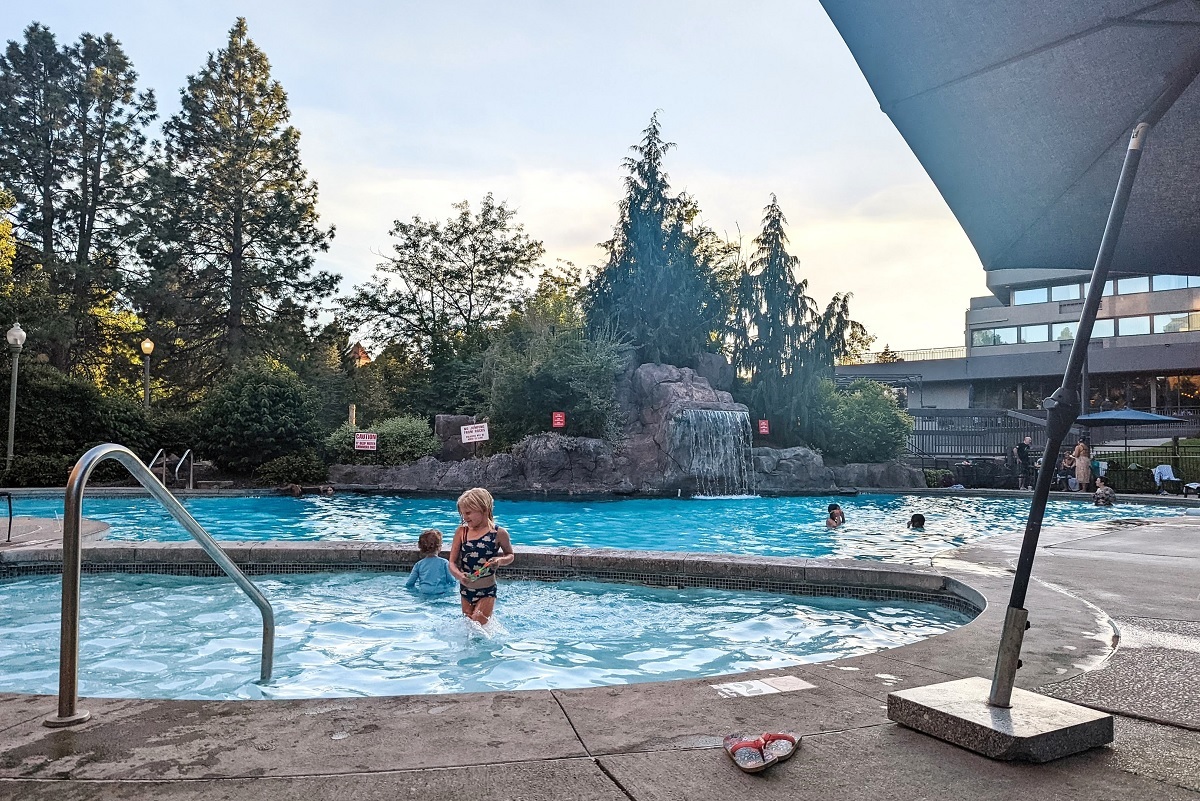 A young girl stands in the smaller pool of two pools at Spokane's Centennial Hotel, centrally located base for families visiting Spokane