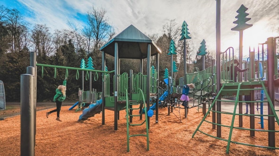 Kids play on the new play structures at Seattle’s renovated Fairmount Playground. 