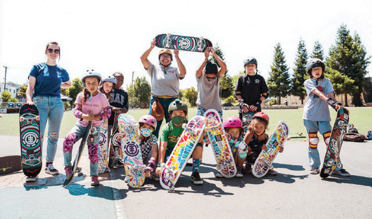 Group of kids holding skateboards