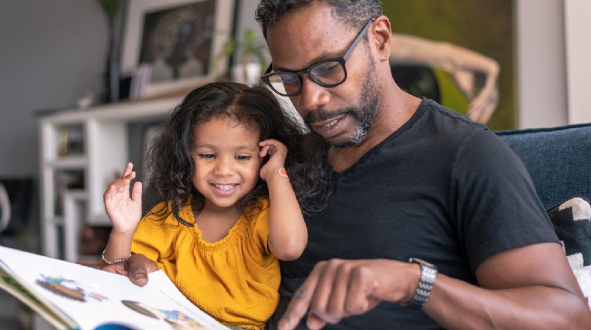 dad-reading-book-to-preschool-girl