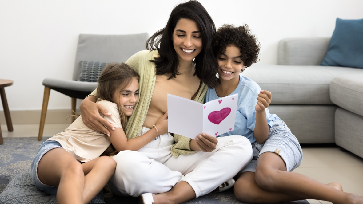 mom and two kids with homemade DIY mother's day card