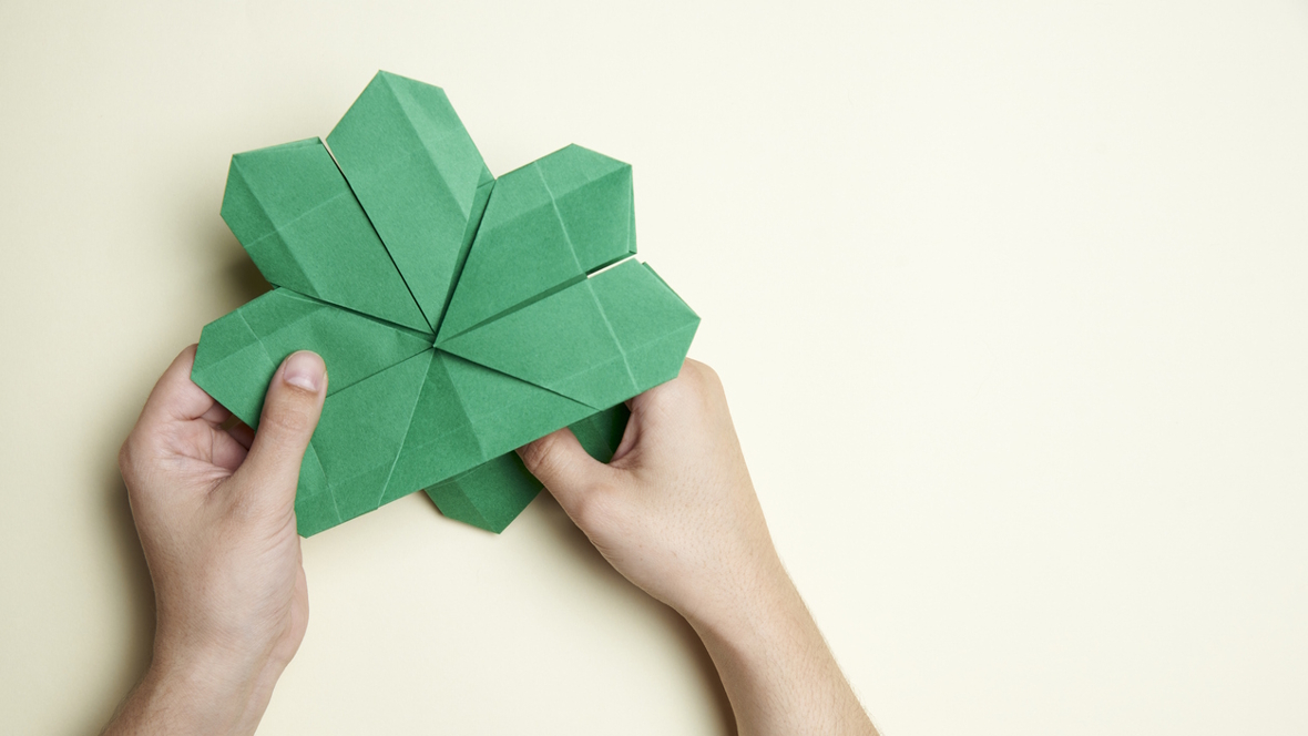 an origami shamrock that can be used as a bookmark