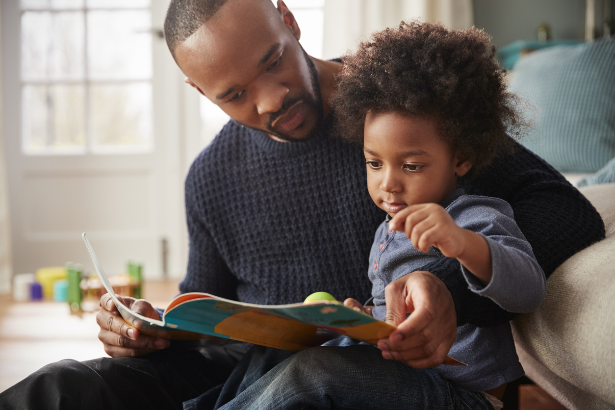 father and son reading