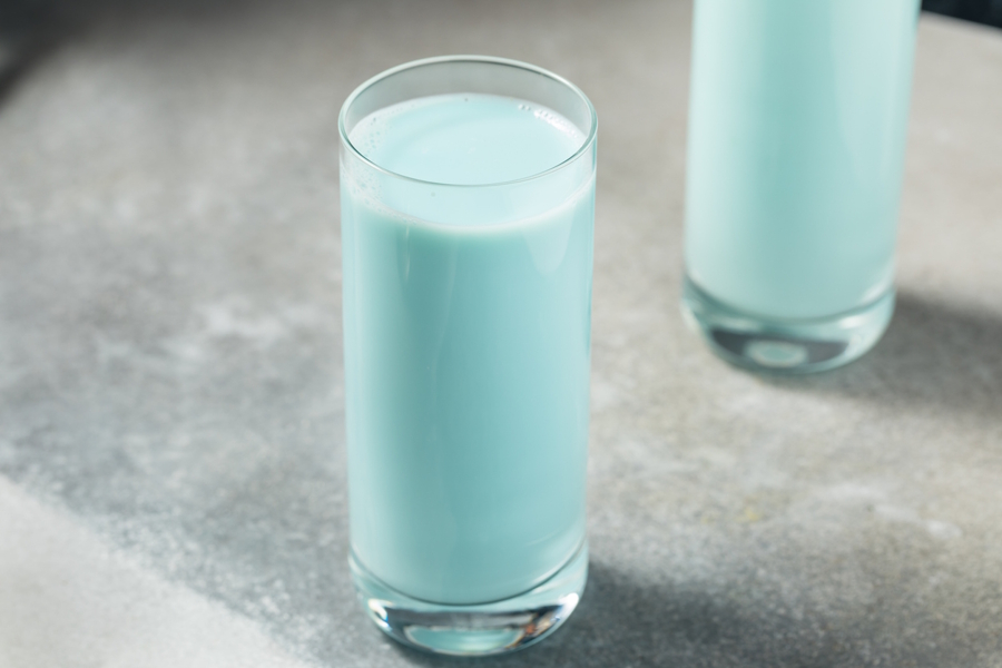 a glass of milk dyed blue for April Fools Day