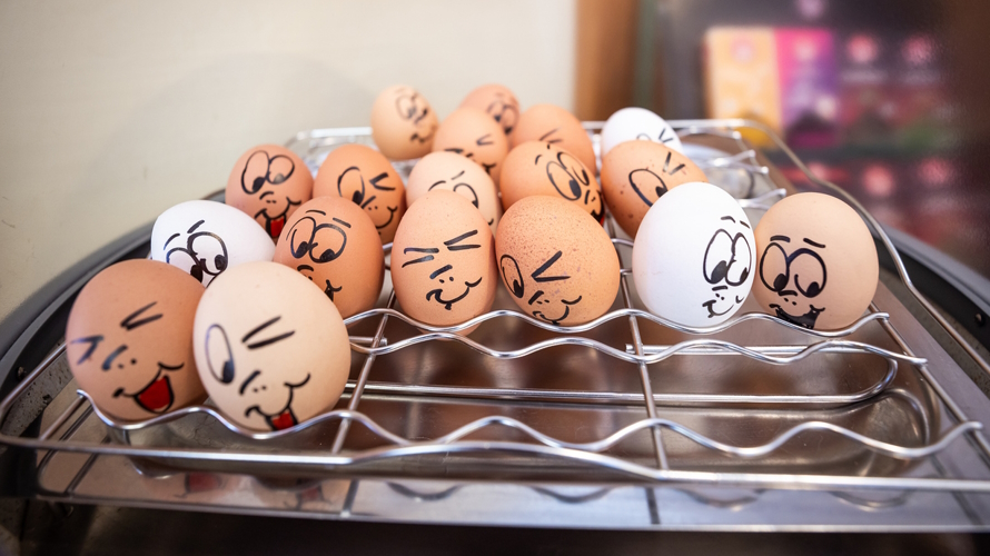 Eggs with faces drawn on April Fools Day jokes for kids