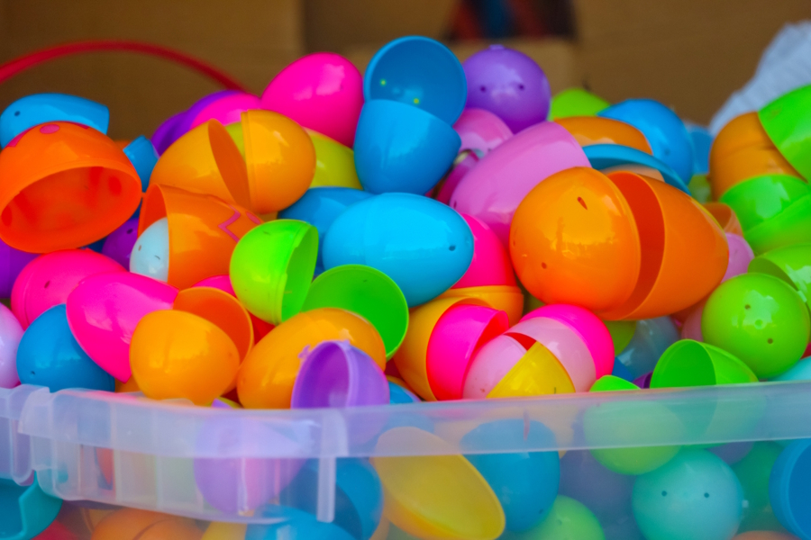 a large pile of brightly colored plastic Easter eggs