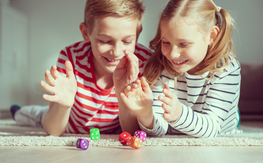 kids rolling dice