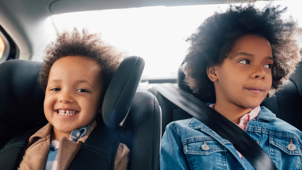 two kids in a car on a family road trip