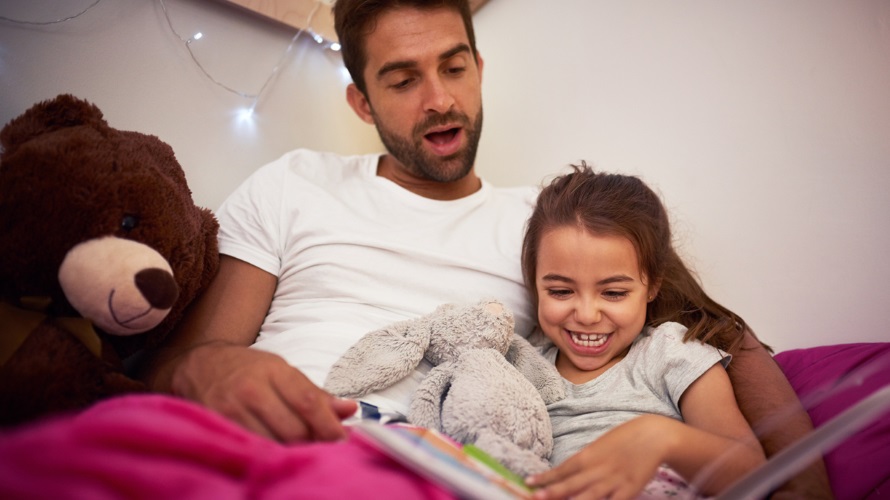 Dad reading to kid
