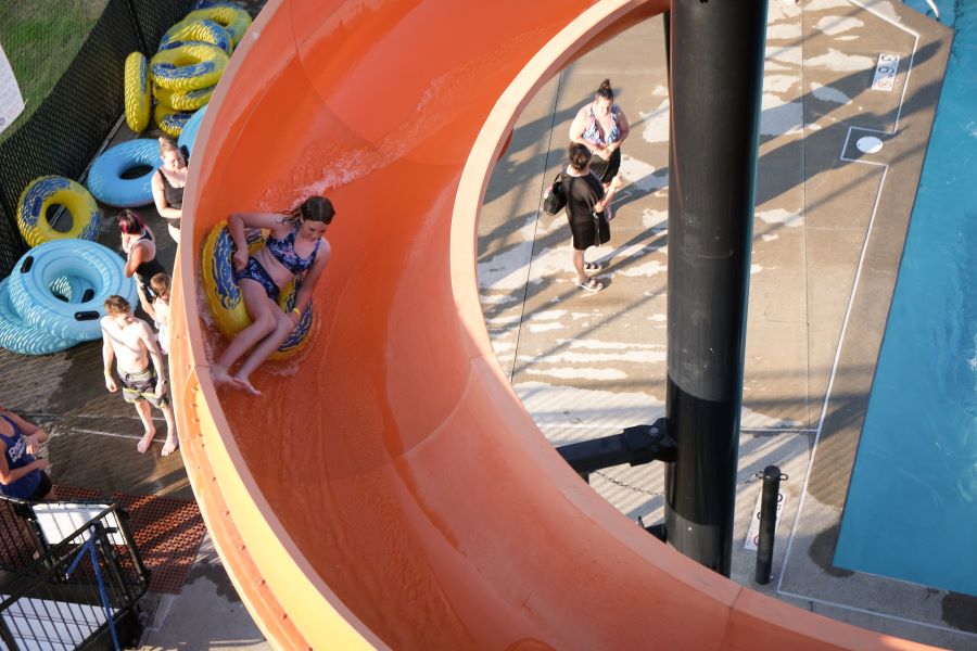 Girl goes down water slide at Henry Moses Aquatic Center.