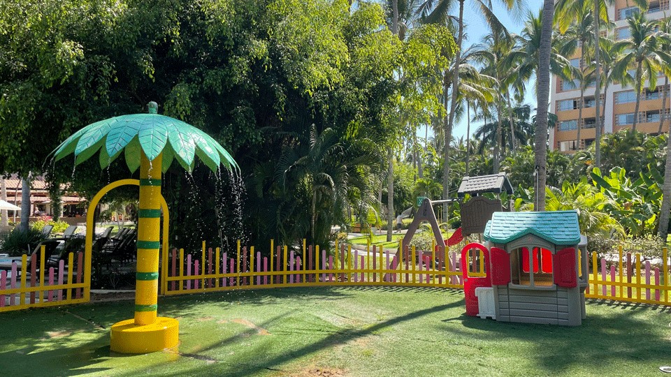 Westin Kids Club outside area with a palm tree sprayer