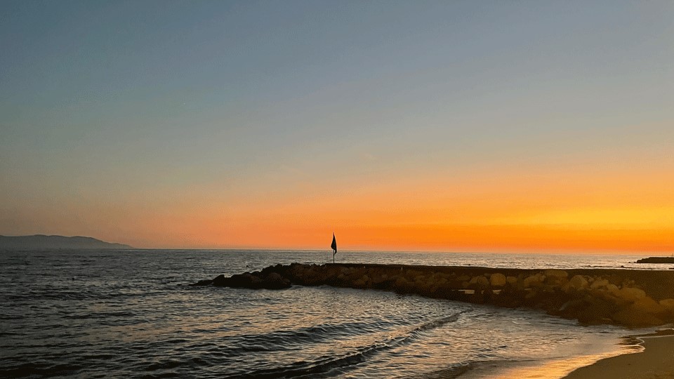Sunset on a beach in Puerto Vallarta with an orange sky