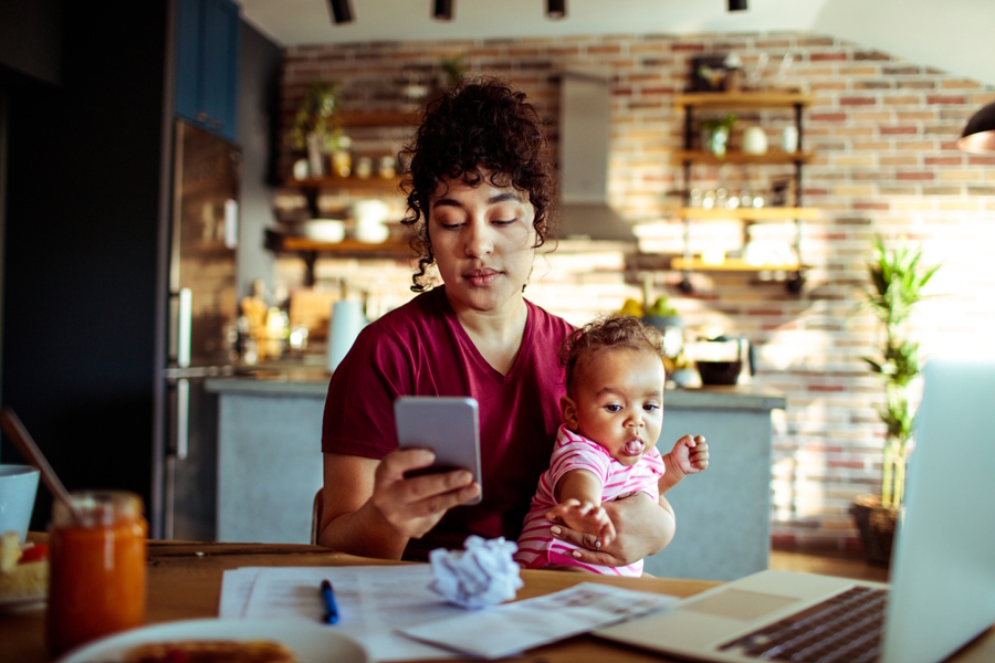 young mom using app to organize family and home life