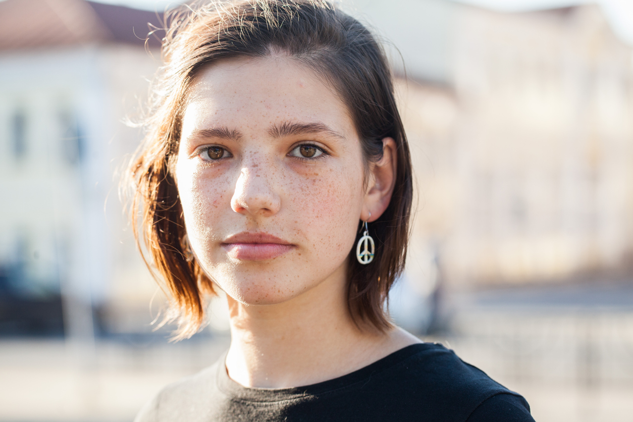 serious-looking teen girl