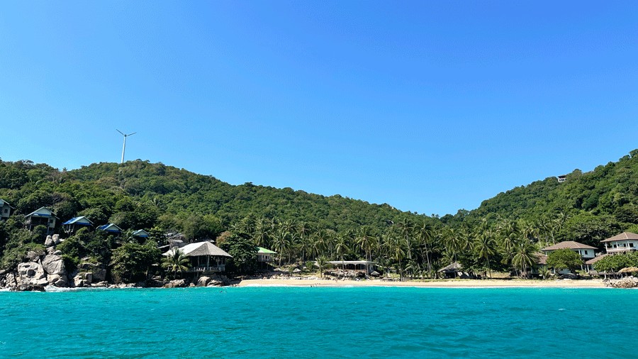 view from the water of Ko Taen, an island you can boat to in Thailand on a family vacation