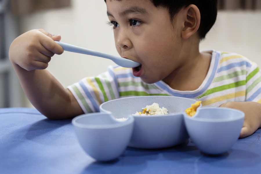 a child eats from his favorite bowl