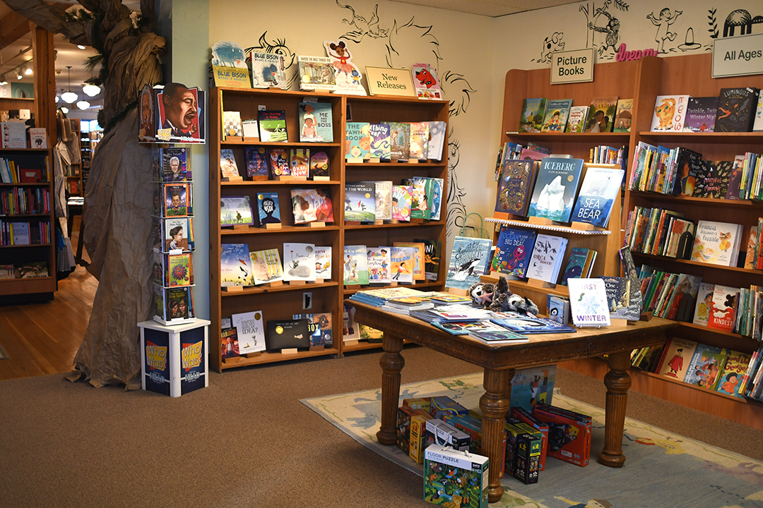 A family browses for books at Bainbridge Island's Eagle Harbor Book Co. among fun stops during an easy day trip to Bainbridge Island's main town of Winslow from Seattle