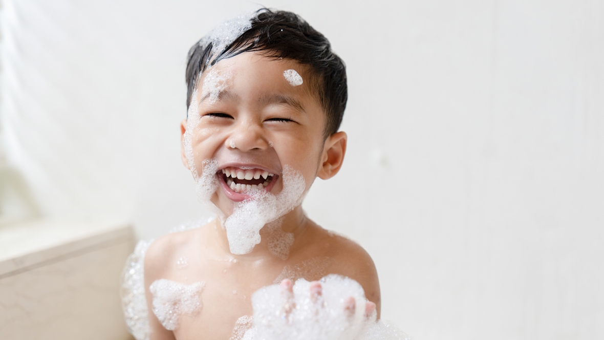 boy having fun in the bath tub
