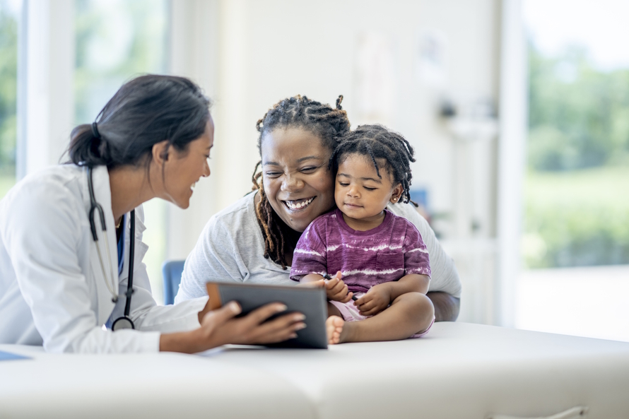 Doctor talking to a mom and her baby