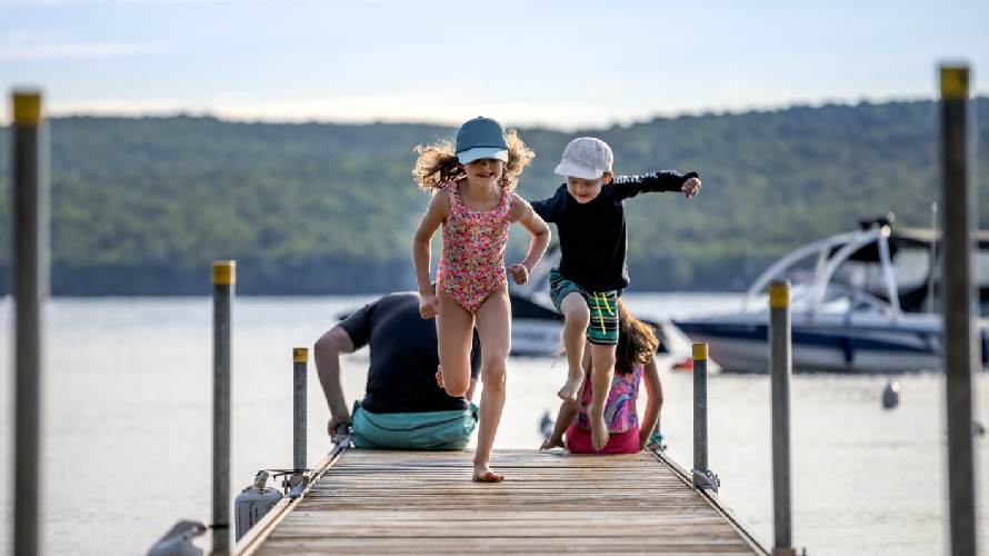 kids-running-on-dock-in-summer