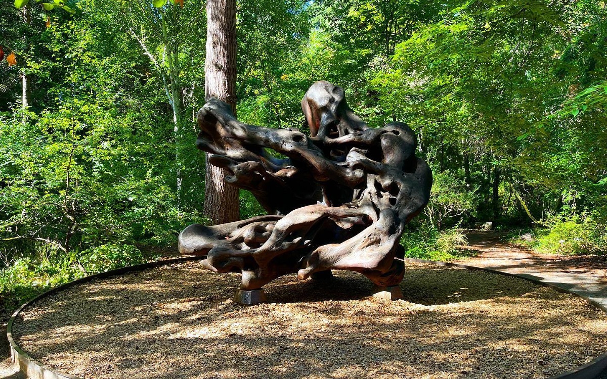 Kruckeberg Botanic Garden in Shoreline near Seattle is a fun place to explore with kids, especially its sculpture called Wood Wave that kids can climb on