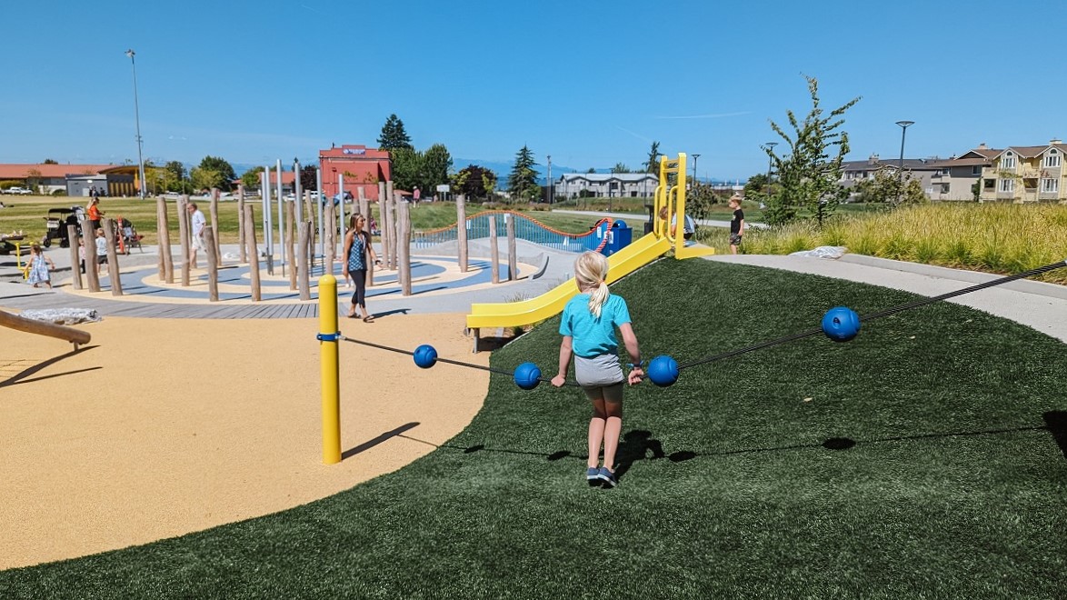 Kids play on the new Mika’s Playground at Edmonds Civic Center Playfield