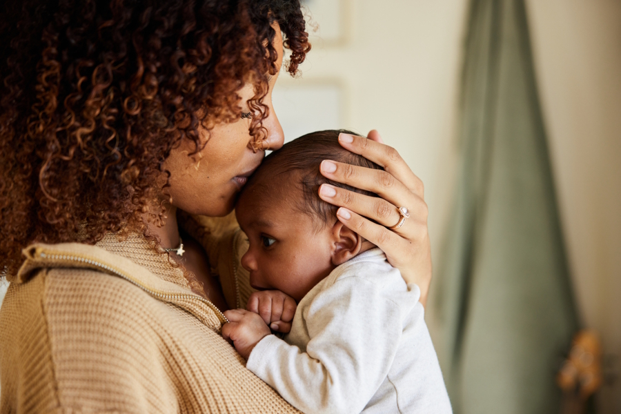mom providing positive caregiving five factors for baby to thrive