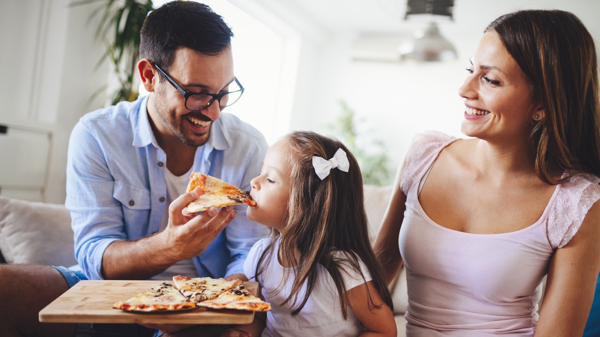 family eating frozen pizza