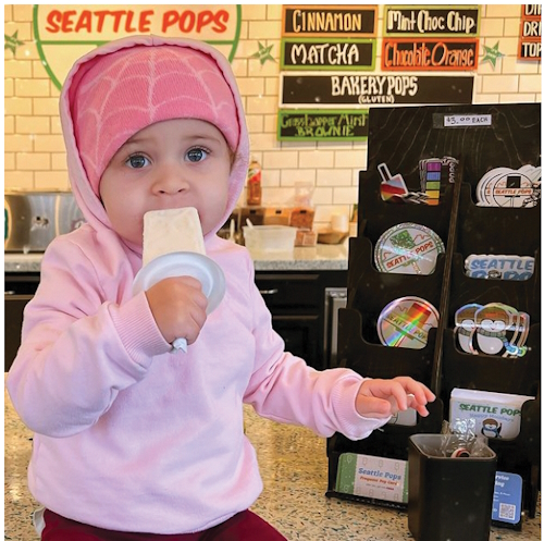 enjoying a frozen treat from Seattle Pops