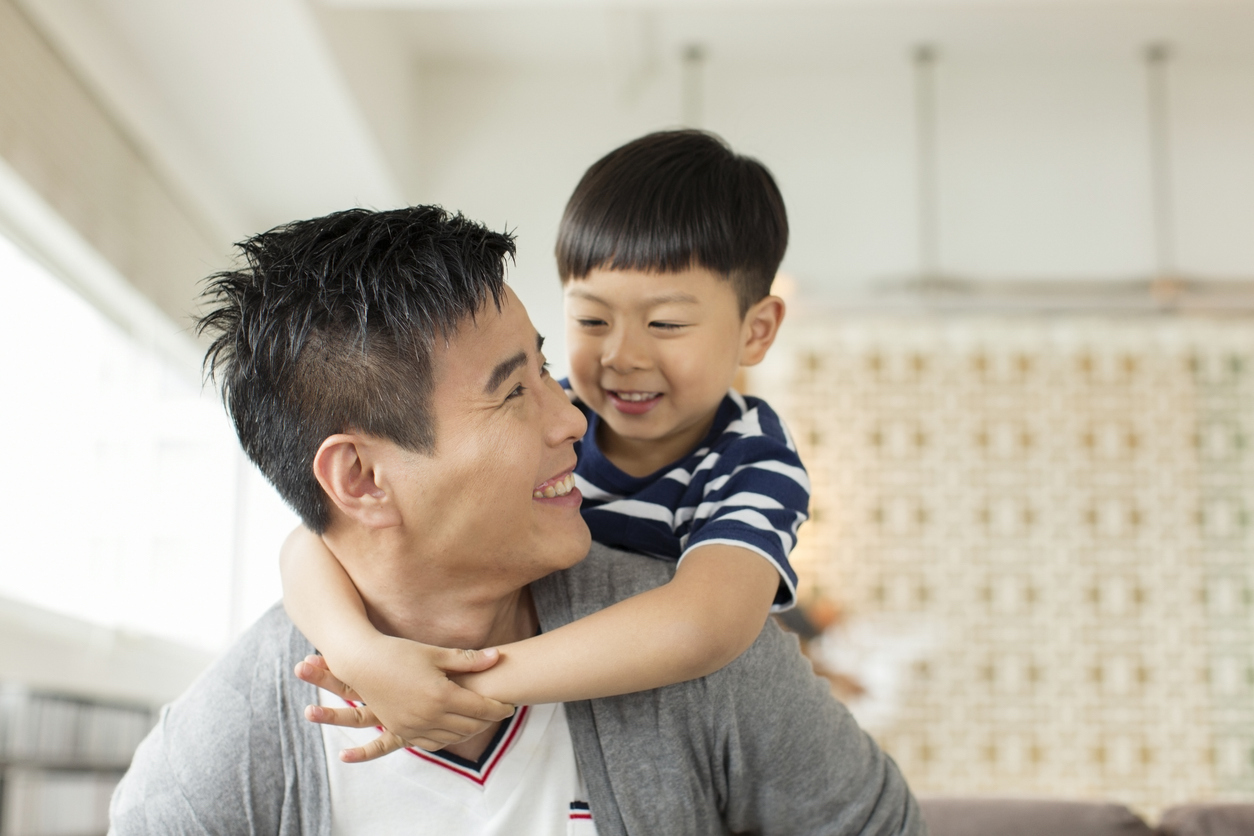 dad and son enjoying a hug