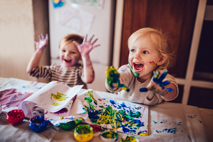creative toddlers having fun getting messy making art